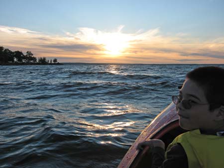 Jon in kayak with sunset