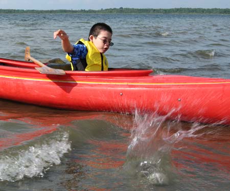 Jon's thrown rock splashes in the water