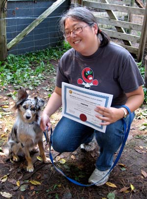Laura holding Photons certificate