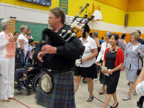 Bagpiper leading the processional