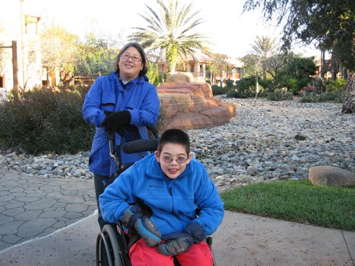 Laura and Jon in cold weather gear with cactuses