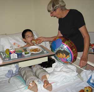 Grandma feeding Jon a hotdog