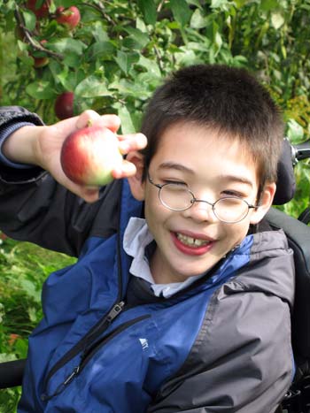 Jon holding up an apple