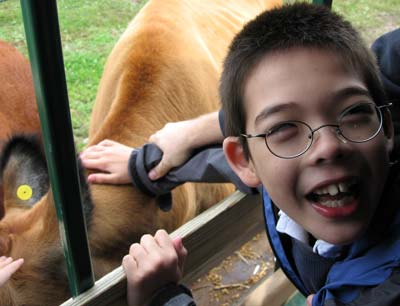 Jon patting cow on hayride