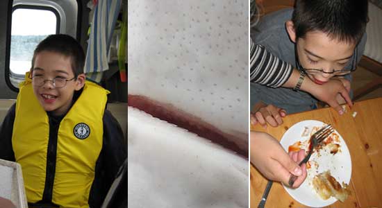 Jon's in boat cabin, fish teeth, eating shark