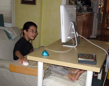 Jon in armchair, happy